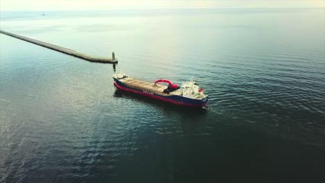 drone following around the big cargo ship