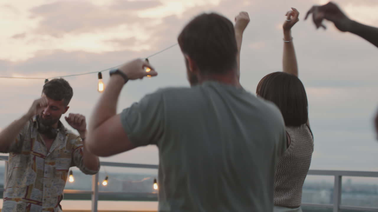 Happy People Partying on Summer Evening