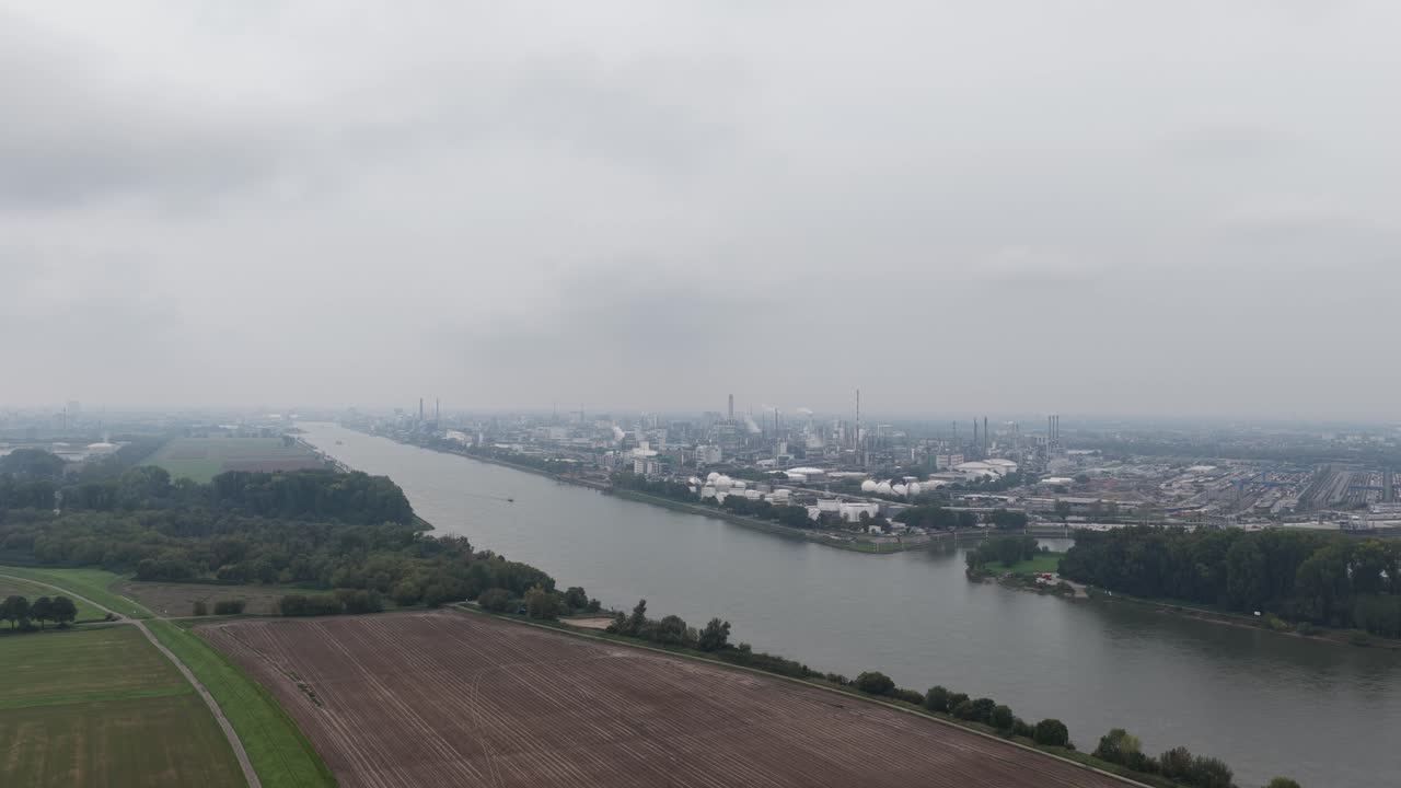 Ludwigshafen am Rhein, Germany, largest integrated chemical complex. production facilities, energy flows and logistics. Aerial drone video on cloudy day