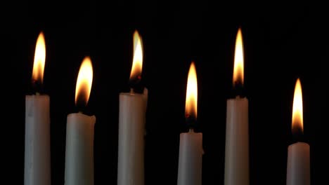 six flickering white taper candles loop