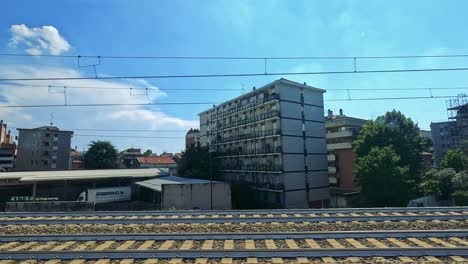 scenic train ride showcasing milan's architecture and greenery