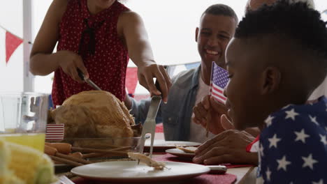 multi-generation family having celebration meal