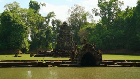 temple of neak pean or neak poan surrounded by jayatataka baray lake at angkor wat complex, siem reap, cambodia