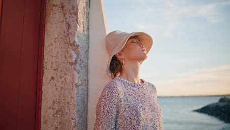carefree woman resting evening at seashore closeup. calm beautiful girl closing