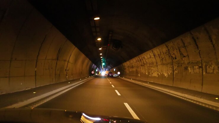 Car journey through a tunnel in Italy