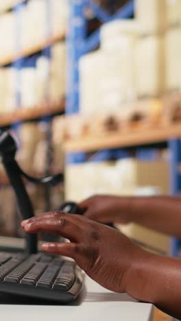 vertical video african american staff scanning awb labels after packaging tasks