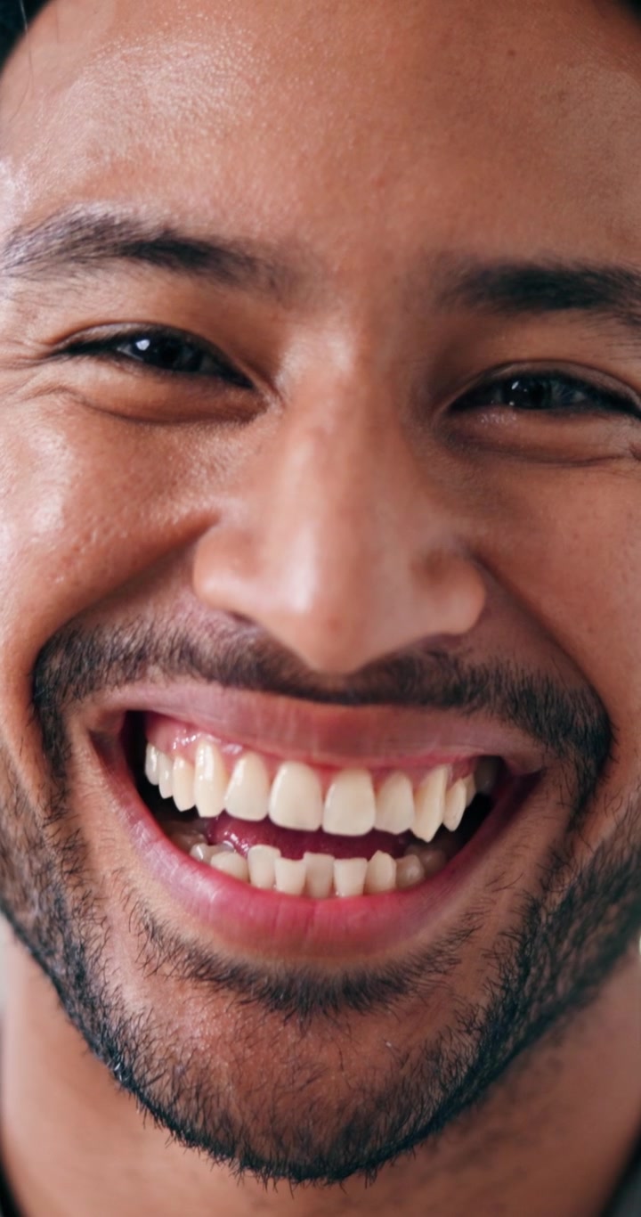 Close-up Portrait of a Smiling Young Man