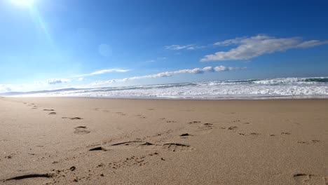 sea foam rushing over sand