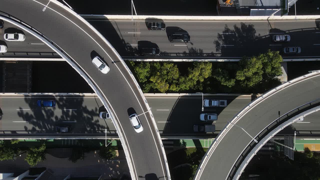 Network of overpasses along the Brisbane River connecting roadways to the Brisbane City and surrounding areas. Aerial view
