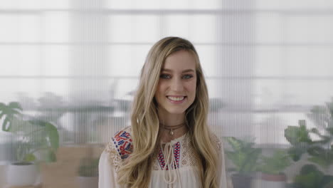 portrait of beautiful blonde business woman intern smiling happy looking at camera enjoying working lifestyle in office workpace background