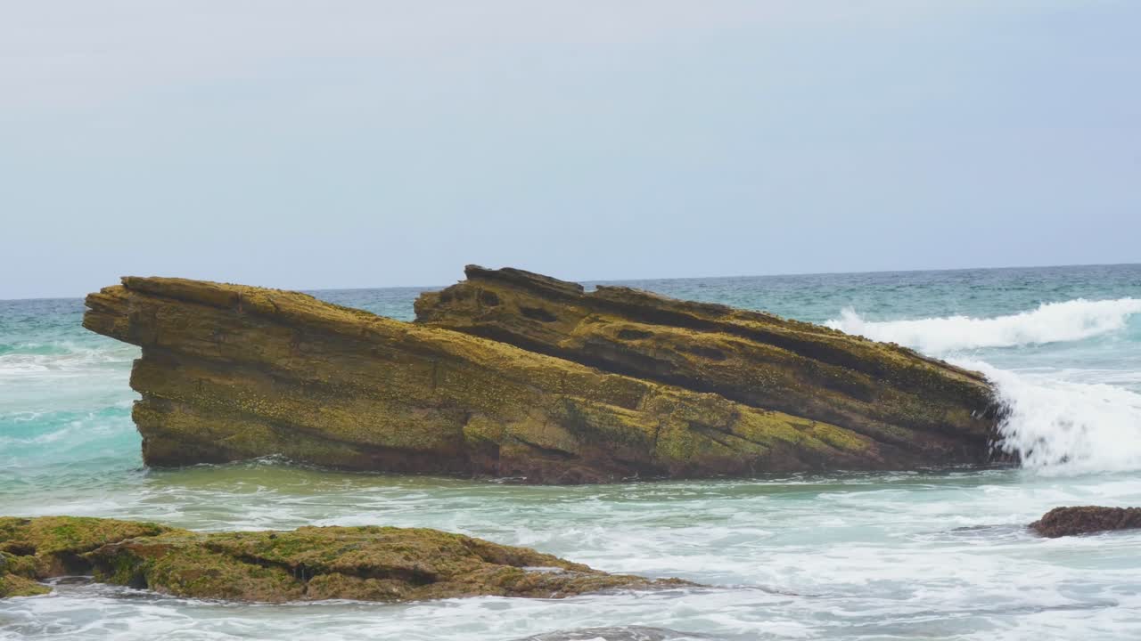 Rock in the misty ocean