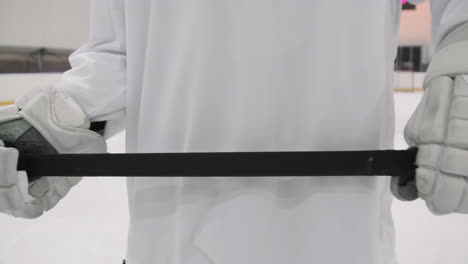 Hockey Player Holding Stick