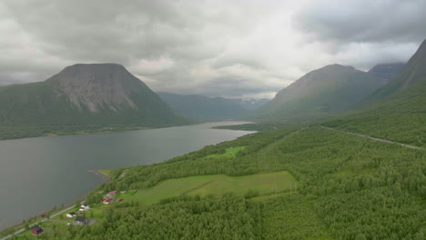 aerial over forested landscape next to e6 highway toward nordkjosbotn, norway