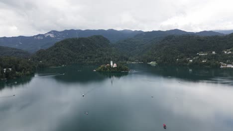 island on a lake with a big church