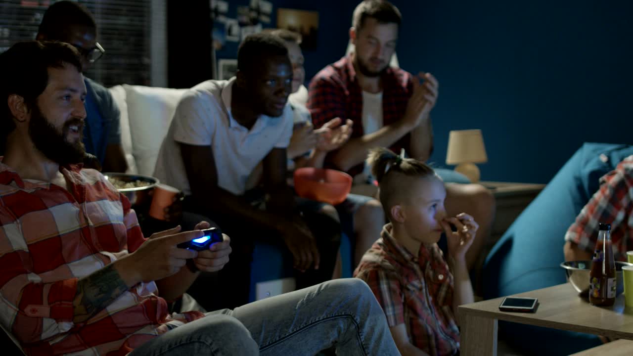 Diverse people entertaining with videogame