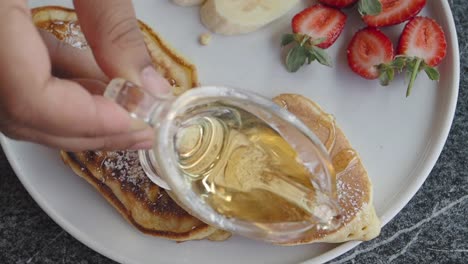 delicious pancakes with honey and powdered sugar