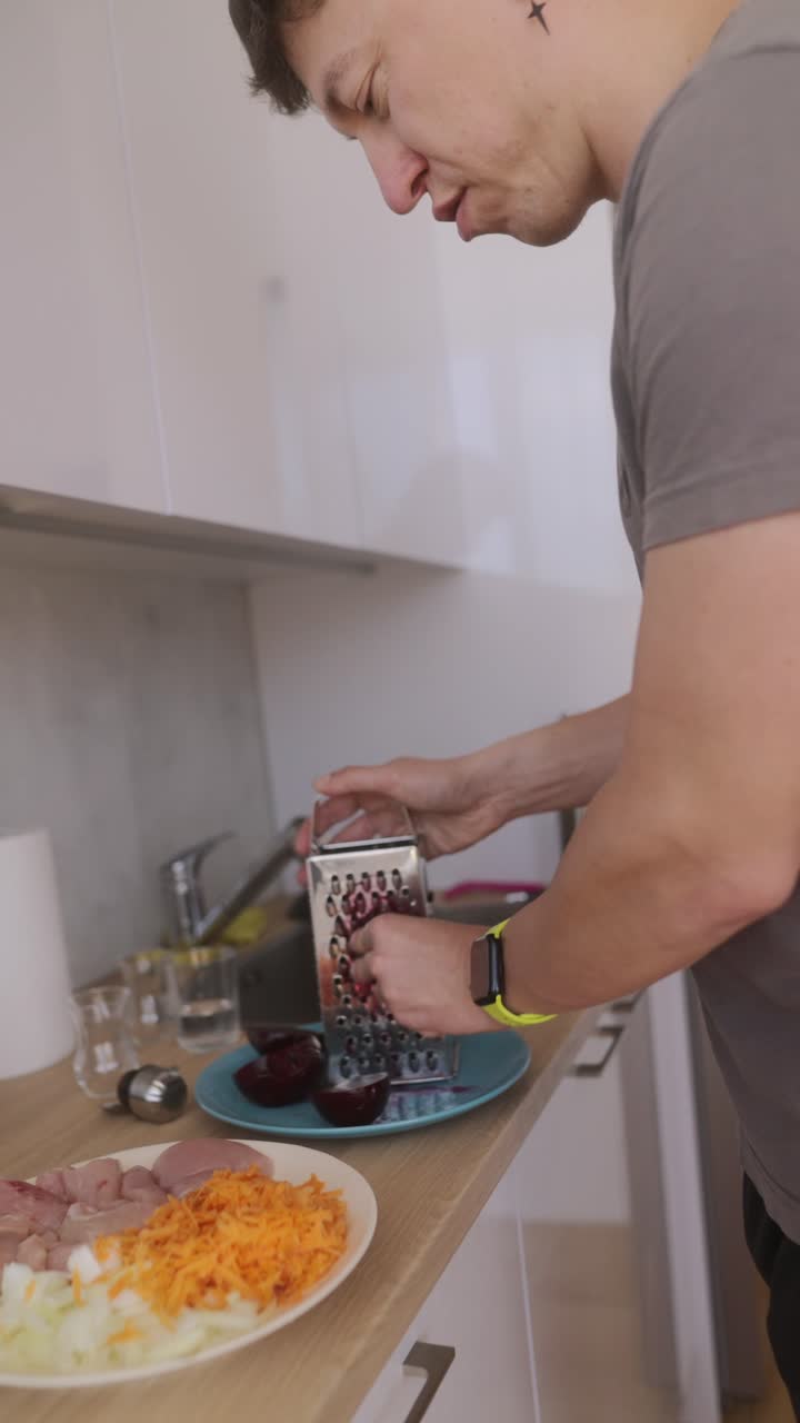Man preparing vegetables and meat for cooking