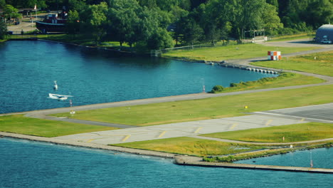 a small plane lands at the central island airfield in toronto