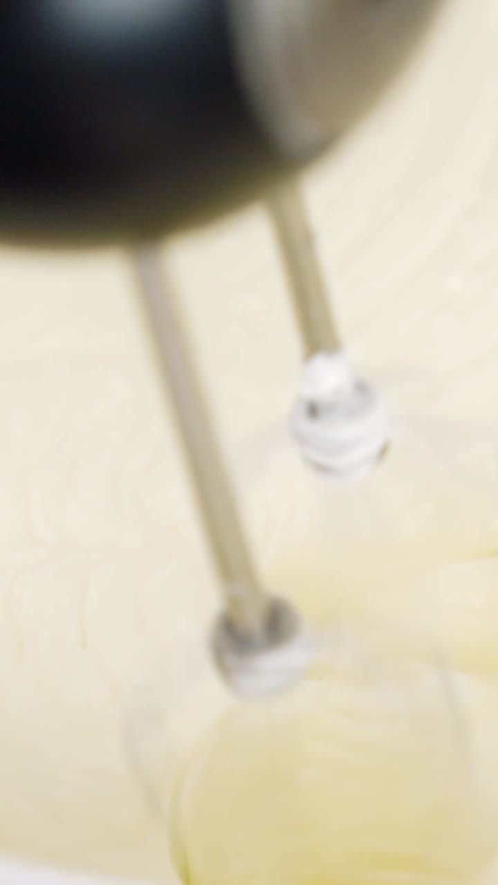 Final stage of whipping a smooth and decadent cream cheese frosting