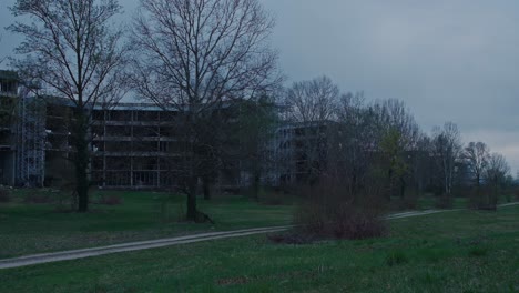 Abandoned-hospital-façade-looms-over-Zagreb's-greenery,-Croatia