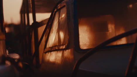 rusty fishing boat at sunset