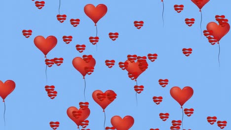 Multiple-heart-shaped-balloons-floating-against-blue-background