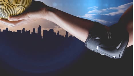 Animation-of-hand-of-caucasian-female-handball-player-holding-ball-over-cityscape