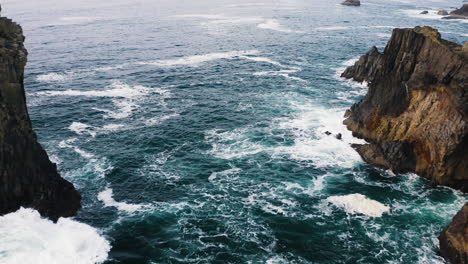 Aerial-descent-towards-turbulent-Pacific-Ocean-breaking-against-Oregon-Coast