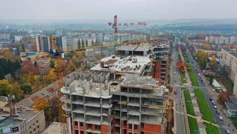 construction site with cranes. aerial shot of the skyscraper building in the process of construction