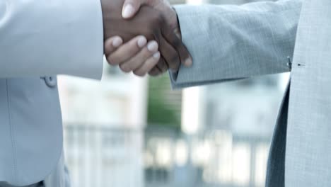 slow motion shot of business people shaking hands