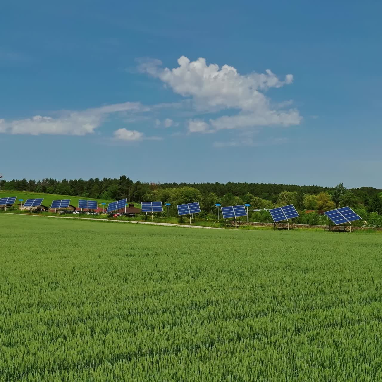 Solar cells on green field. Beautiful landscape of nature and photovoltaic solar panels on field generate clean energy at sunlight. Renewable energy.