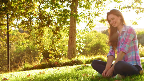 woman sitting cross-legged very happy