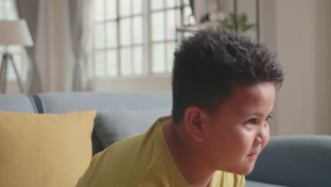 young boy gamer holding joystick feeling disappointed during playing video game