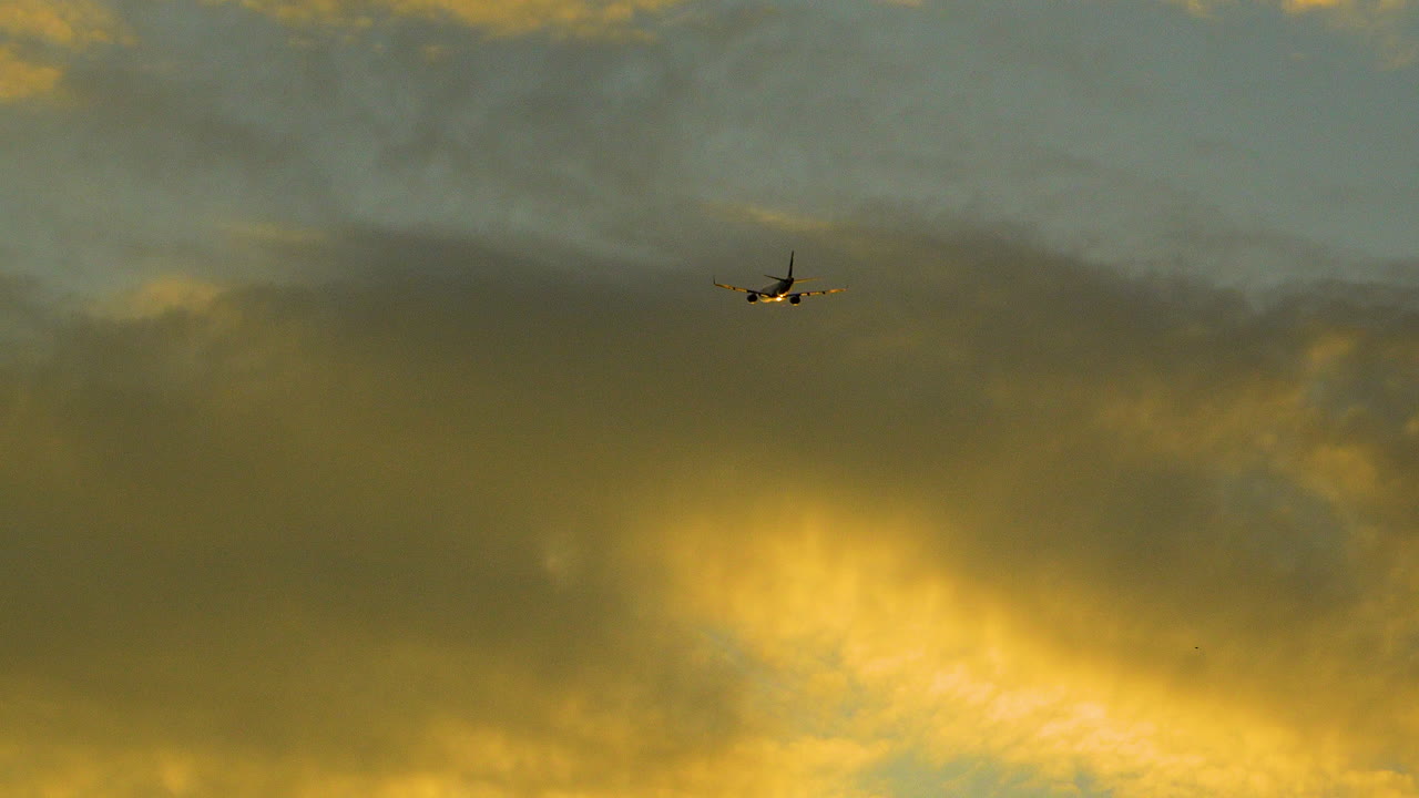 Plane heading into the sunset