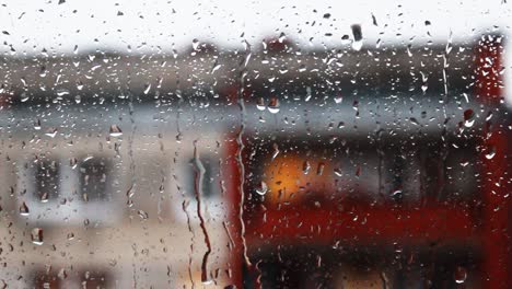 heavy rain rains through window glass, slow motion