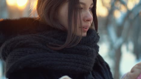 woman with a child in the winter park