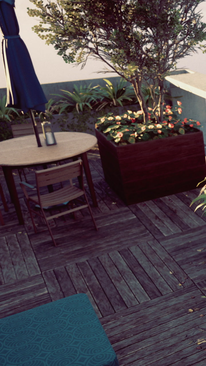 Outdoor seating area with table and plants in urban setting