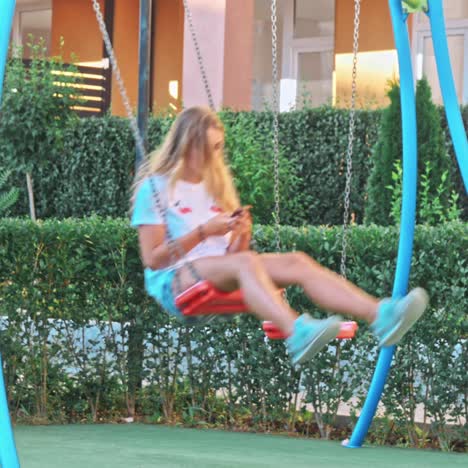 ten girl having fun on swings.