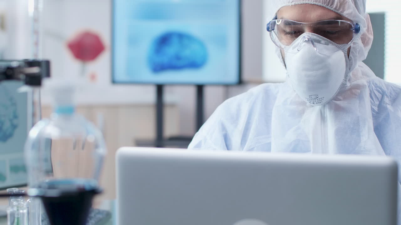 Scientist in lab with computer