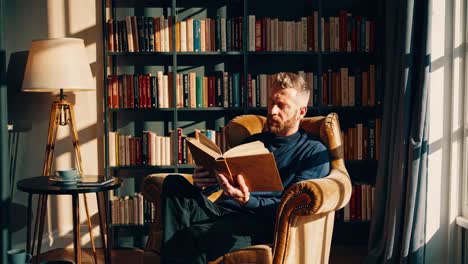 man reading in a cozy home library