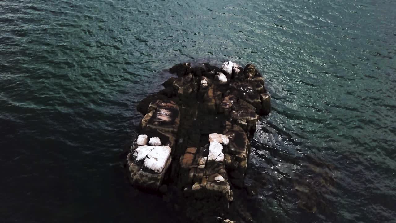 Aerial circle view of a rock in the middle of the sea. Swamscott beach