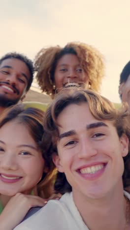 crazy group of multi-ethnic friends taking a happy selfie outdoors