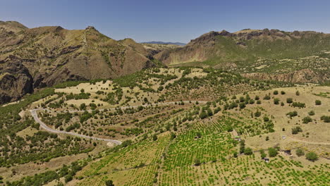 ankara province turkey aerial v3 rural landscape view, low level drone flyover kuşcuören capturing winding hillside road surrounded by rocky mountainscape - shot with mavic 3 cine - july 2022