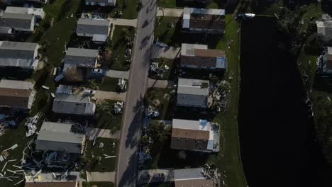 downward aerial view of the destruction caused at a mobile home park atter hurricane ian