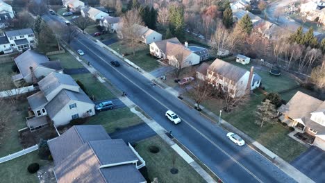 traffic on street through residential community in usa during winter season