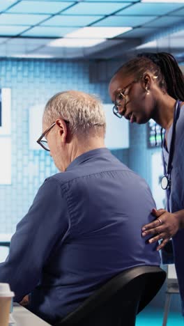 doctor examining patient's back