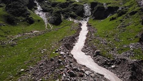 glacial waterfalls from the mountains near stausee wasserfallboden lake in kaprun, austria