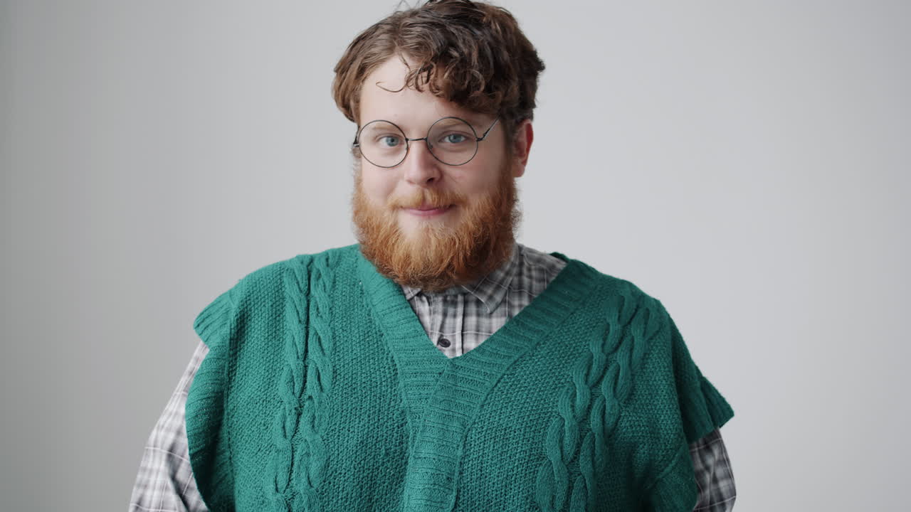 Man wearing a green sweater vest