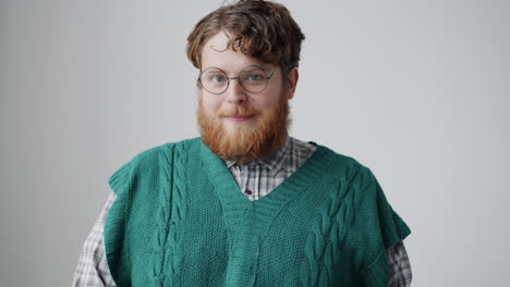 man wearing a green sweater vest