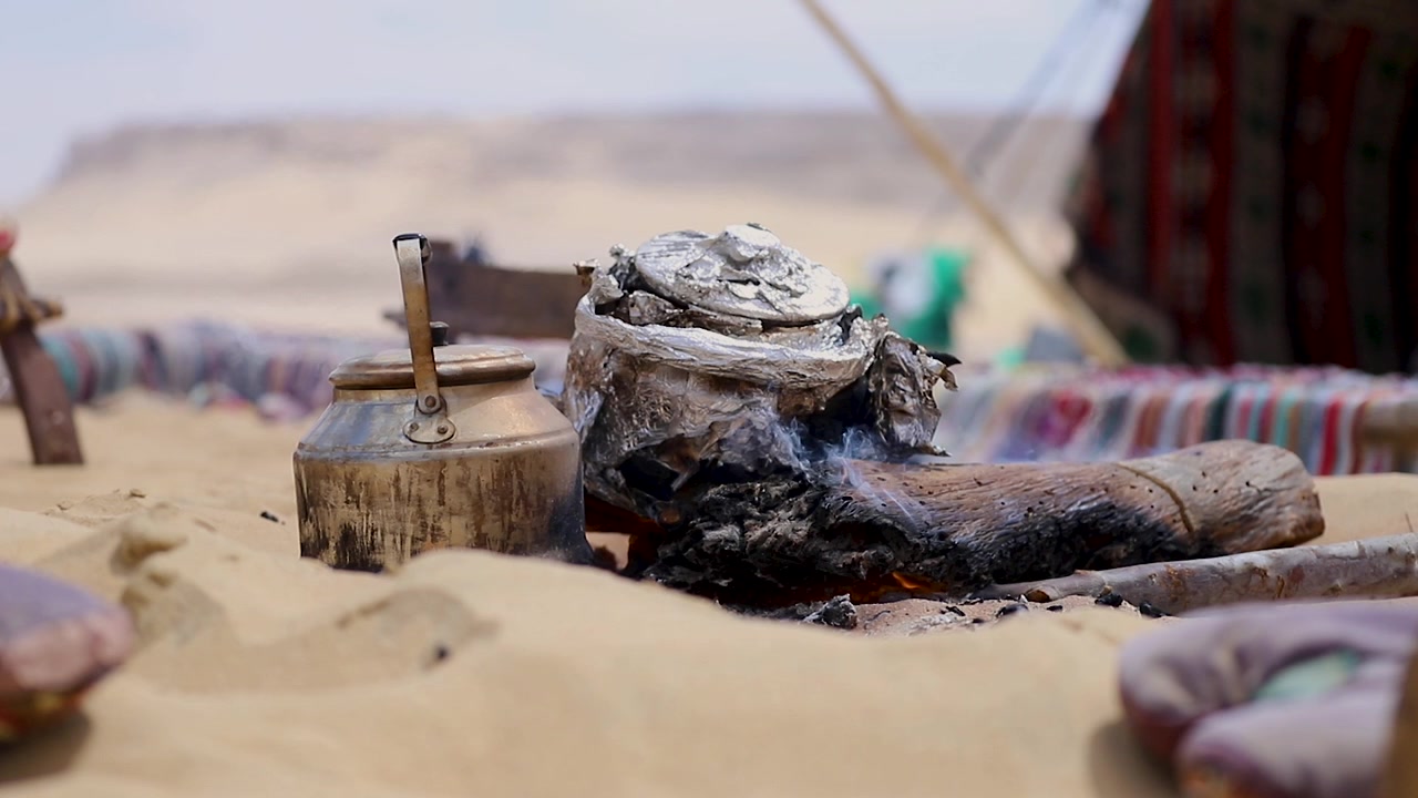 Making tea over wood burning in a Bedouin camp in the desert